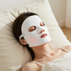 Woman relaxing wearing the LUMARA LED therapy mask